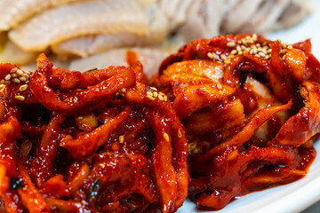 spicy radish kimchi with boiled pork and fermented skate in Samhap cuisine