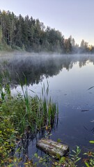 Morning fog over the lake. Autumn landscape. Karelia, Russia