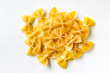 raw farfalle pasta isolated on white background