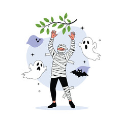 Obraz premium A person dressed as a mummy with ghost decorations around them.
