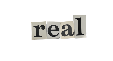 Real Word Concept with Cut-Out Letters on White Surface