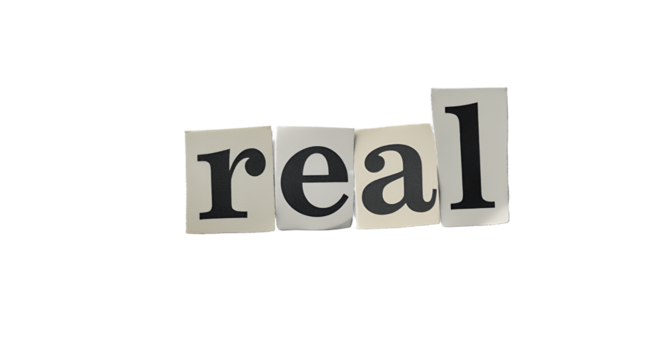 Real Word Concept with Cut-Out Letters on White Surface