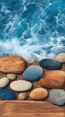 A serene coastal scene featuring smooth, colorful stones resting on a sandy beach, with the vibrant blue ocean waves gently crashing in the background, creating a peaceful and natural atmosphere