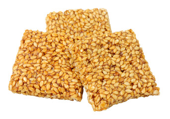 Group of sesame seed chikki traditional Indian sweet snacks isolated on a white background