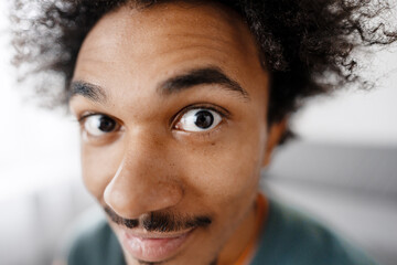 Young man staring wide eyed with curiosity