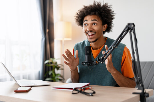 Young man recording podcast in home studio - Powered by Adobe