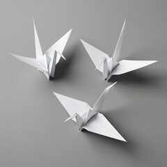 Naklejka premium Three Paper Cranes Origami on Neutral Background Top View