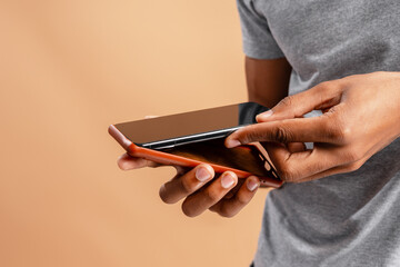 Man hands inserting phone into protective case