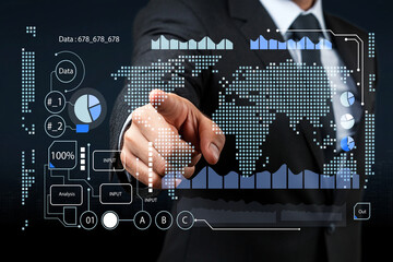 Business Professional Interacting with Digital Data Visualization on Screen in Modern Office Environment