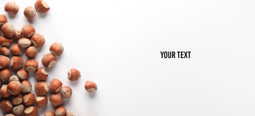 Hazelnuts on a white background. Top view. Copy space