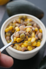 Colorful mix of beans and corn in a small bowl