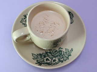 Malaysian Teh Tarik or Hot Milky Drink Served in a Traditional Cup. Mug of Frothy Hot Drink with Subtle Foam Texture