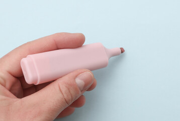 Hand writing with marker on blue background