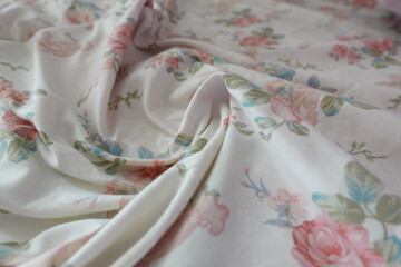 Floral fabric on a flat surface in soft light