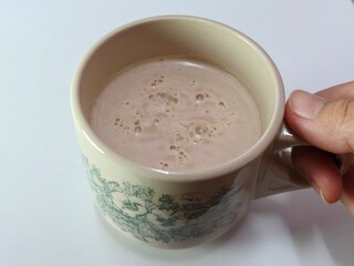 Malaysian Teh Tarik or Hot Milky Drink Served in a Traditional Cup. Mug of Frothy Hot Drink with Subtle Foam Texture