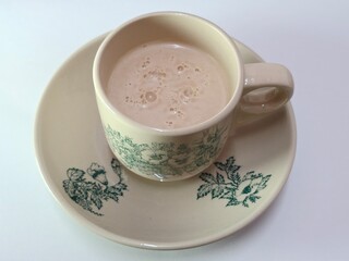Malaysian Teh Tarik or Hot Milky Drink Served in a Traditional Cup. Mug of Frothy Hot Drink with Subtle Foam Texture