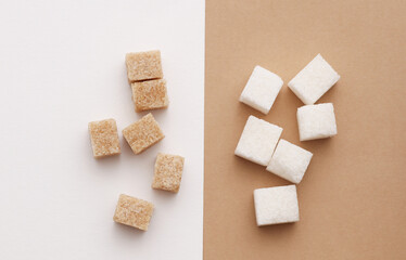 Cubes of white and cane sugar. Top view