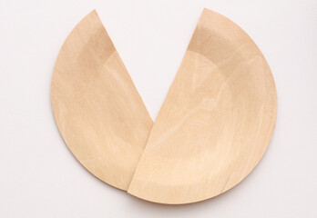 Wooden broken eco plate on white background