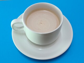Malaysian Teh Tarik or Hot Milky Drink Served in a Traditional Cup. Mug of Frothy Hot Drink with Subtle Foam Texture