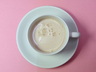 Malaysian Teh Tarik or Hot Milky Drink Served in a Traditional Cup. Mug of Frothy Hot Drink with Subtle Foam Texture
