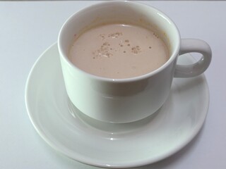 Malaysian Teh Tarik or Hot Milky Drink Served in a Traditional Cup. Mug of Frothy Hot Drink with Subtle Foam Texture