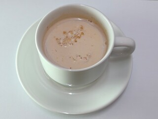 Malaysian Teh Tarik or Hot Milky Drink Served in a Traditional Cup. Mug of Frothy Hot Drink with Subtle Foam Texture