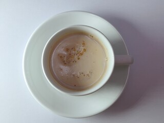 Malaysian Teh Tarik or Hot Milky Drink Served in a Traditional Cup. Mug of Frothy Hot Drink with Subtle Foam Texture