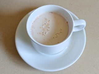 Malaysian Teh Tarik or Hot Milky Drink Served in a Traditional Cup. Mug of Frothy Hot Drink with Subtle Foam Texture