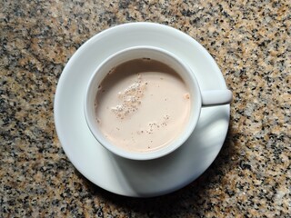 Malaysian Teh Tarik or Hot Milky Drink Served in a Traditional Cup. Mug of Frothy Hot Drink with Subtle Foam Texture