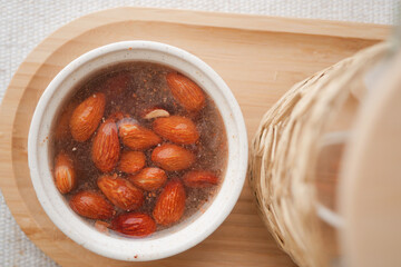 Fresh almonds soaking in water for snack preparation