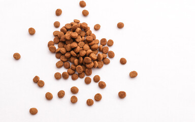 Dry kitten food on a white background