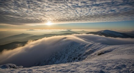 Golden sun illuminates vast snow-capped peaks as atmospheric clouds drift over icy ridges