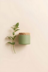 Minimalist natural candle with wooden lid and green eucalyptus branch on beige background, representing calm relaxation, eco-friendly design, and modern aromatherapy home decor aesthetic concept.