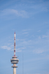 Obraz premium Jakarta’s iconic broadcasting landmark, standing tall under a clear blue sky