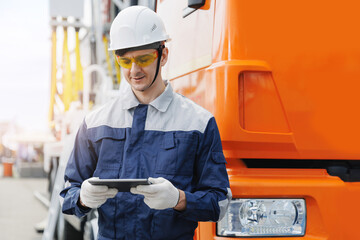 Male worker with tablet on background big truck, AI equipment in mining industry