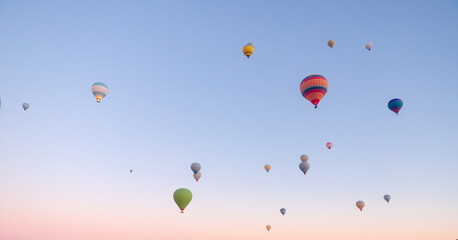 Hot air balloons grace the skies of Cappadocia at sunrise