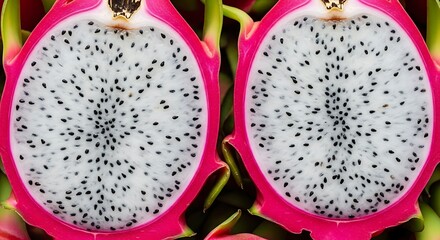 Exotic dragon fruit halves revealing speckled flesh and vibrant rind