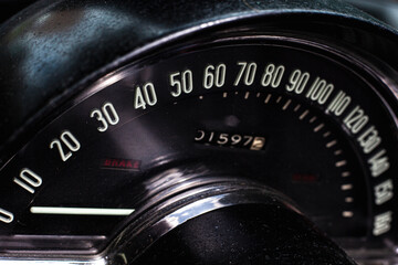 Close up detail of classic car speedometer numbers