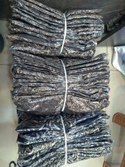 Bundles of black clothing stock