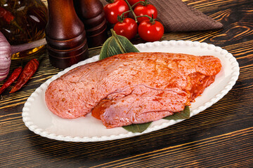 Raw marinated duck breast for cooking