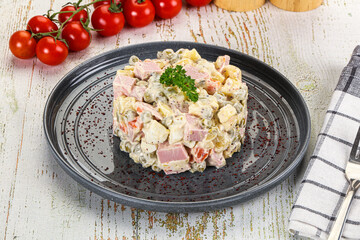 Russian traditional Olivier salad with sausages