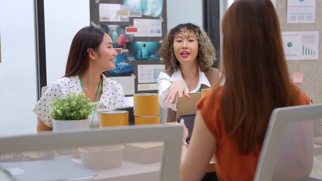 Creative business  product developers actively brainstorm ideas, sharing discussions ESG  green energy focusing on product repackaging and reuse strategies to reduce costs maximize profit business