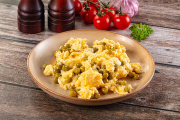 Scrambled egg omelet with green peas