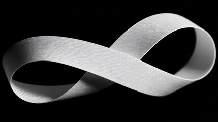 Elegant white ribbon loop on black background for creative design and decoration