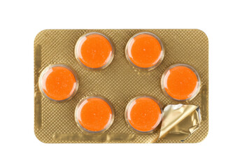 Orange throat lozenges in blister pack isolated, sore throat treatment for cold and flu relief on transparent background