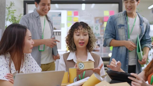 Creative business  product developers actively brainstorm ideas, sharing discussions ESG  green energy focusing on product repackaging and reuse strategies to reduce costs maximize profit business