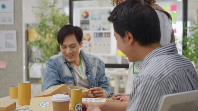 Creative business  product developers actively brainstorm ideas, sharing discussions ESG  green energy focusing on product repackaging and reuse strategies to reduce costs maximize profit business