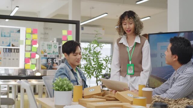 Creative business  product developers actively brainstorm ideas, sharing discussions ESG  green energy focusing on product repackaging and reuse strategies to reduce costs maximize profit business