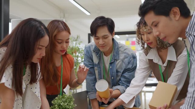 Creative business  product developers actively brainstorm ideas, sharing discussions ESG  green energy focusing on product repackaging and reuse strategies to reduce costs maximize profit business