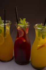 Alcoholic or non alcoholic cocktail in a stylish glass on a gray background, photographed in studio conditions as part of food and beverage product shooting.